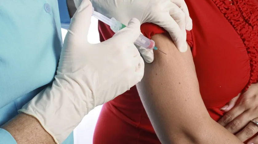Pregnant woman getting a vaccine